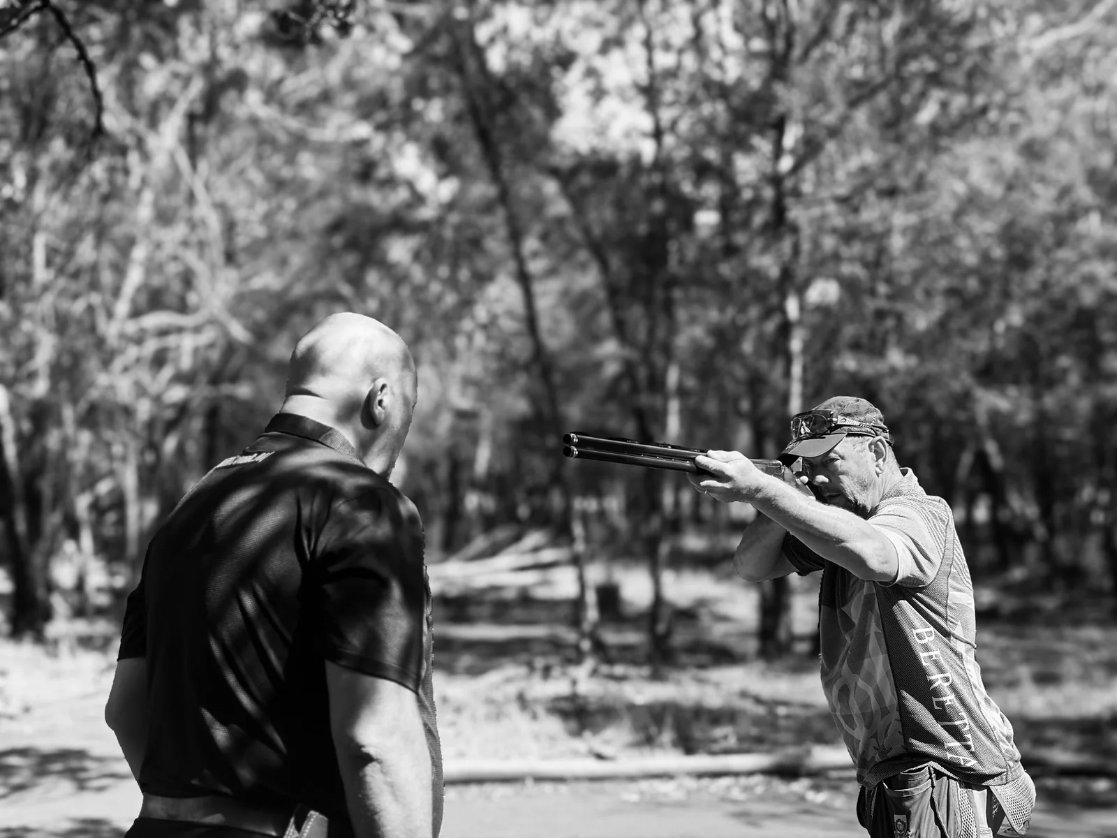 Hardus van Pletsen coaching a clay target shooter at the range